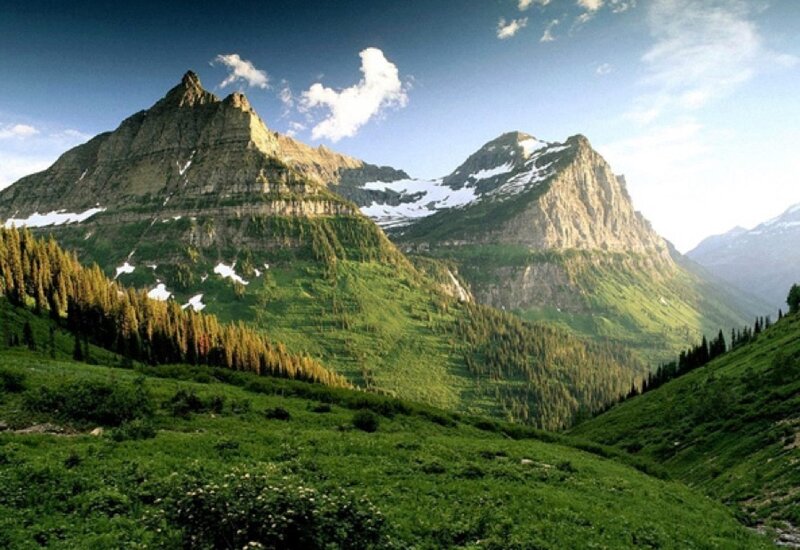 green mountains with snow