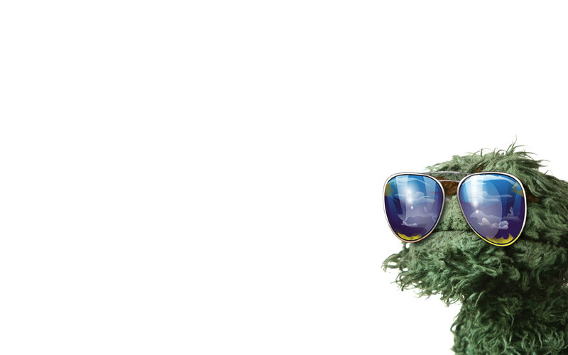 green muppet with sunglasses