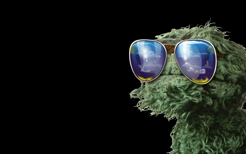 green muppet with sunglasses