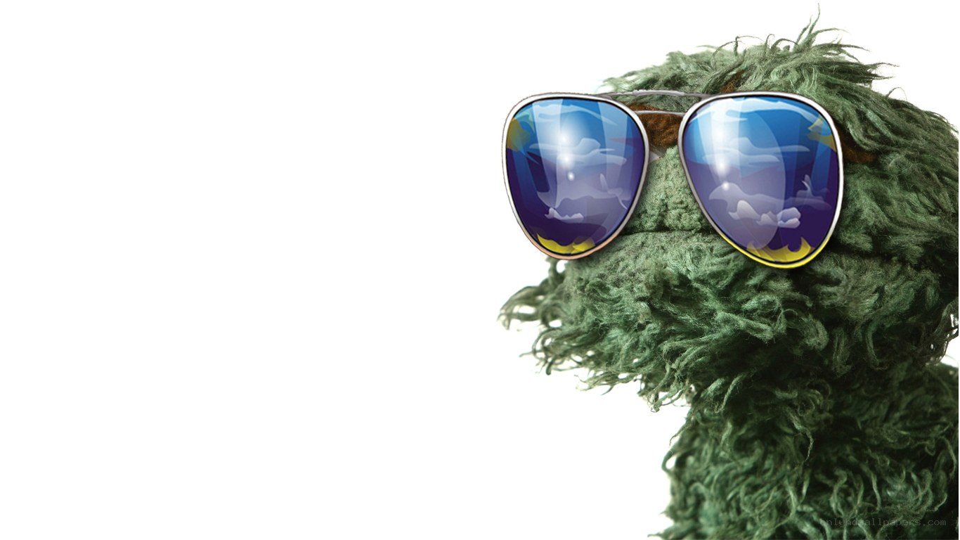 green muppet with sunglasses
