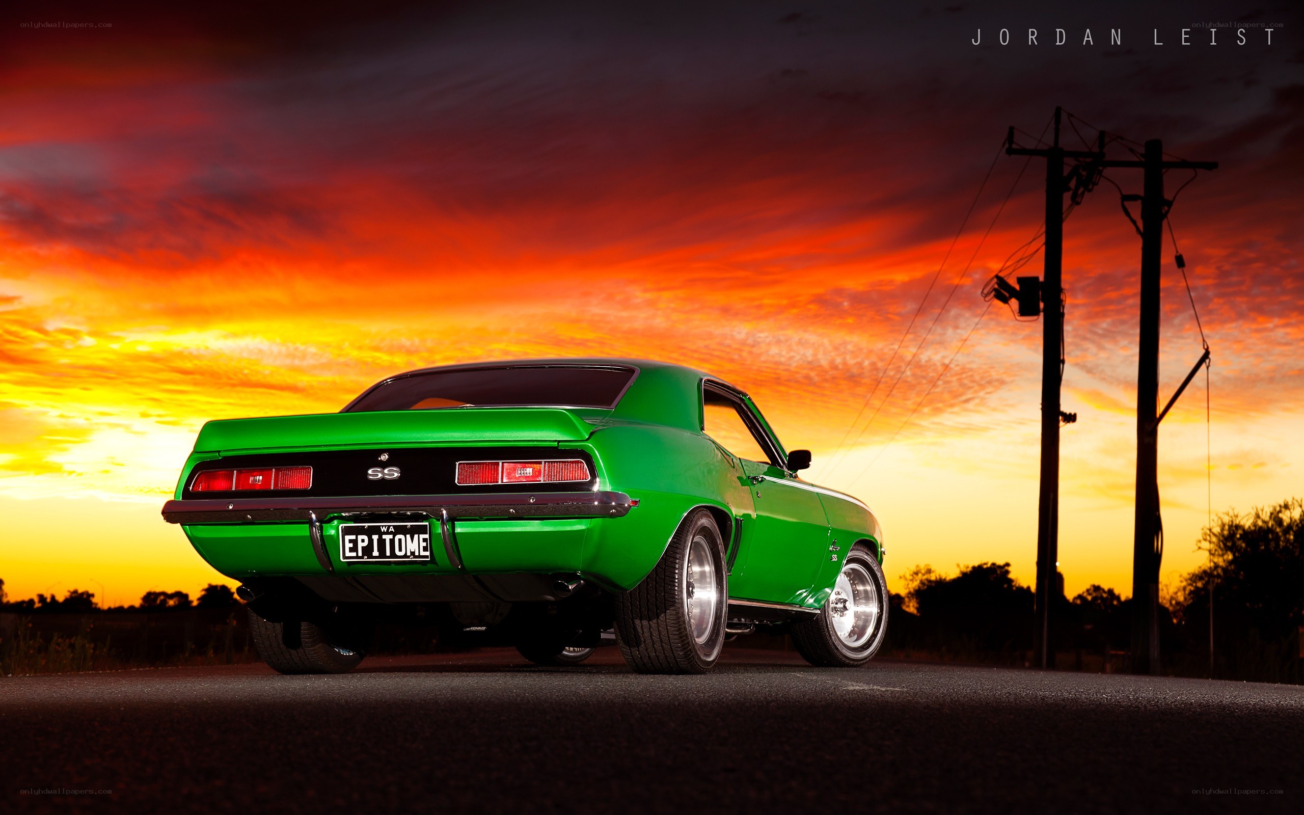 Green muscle car at sunset