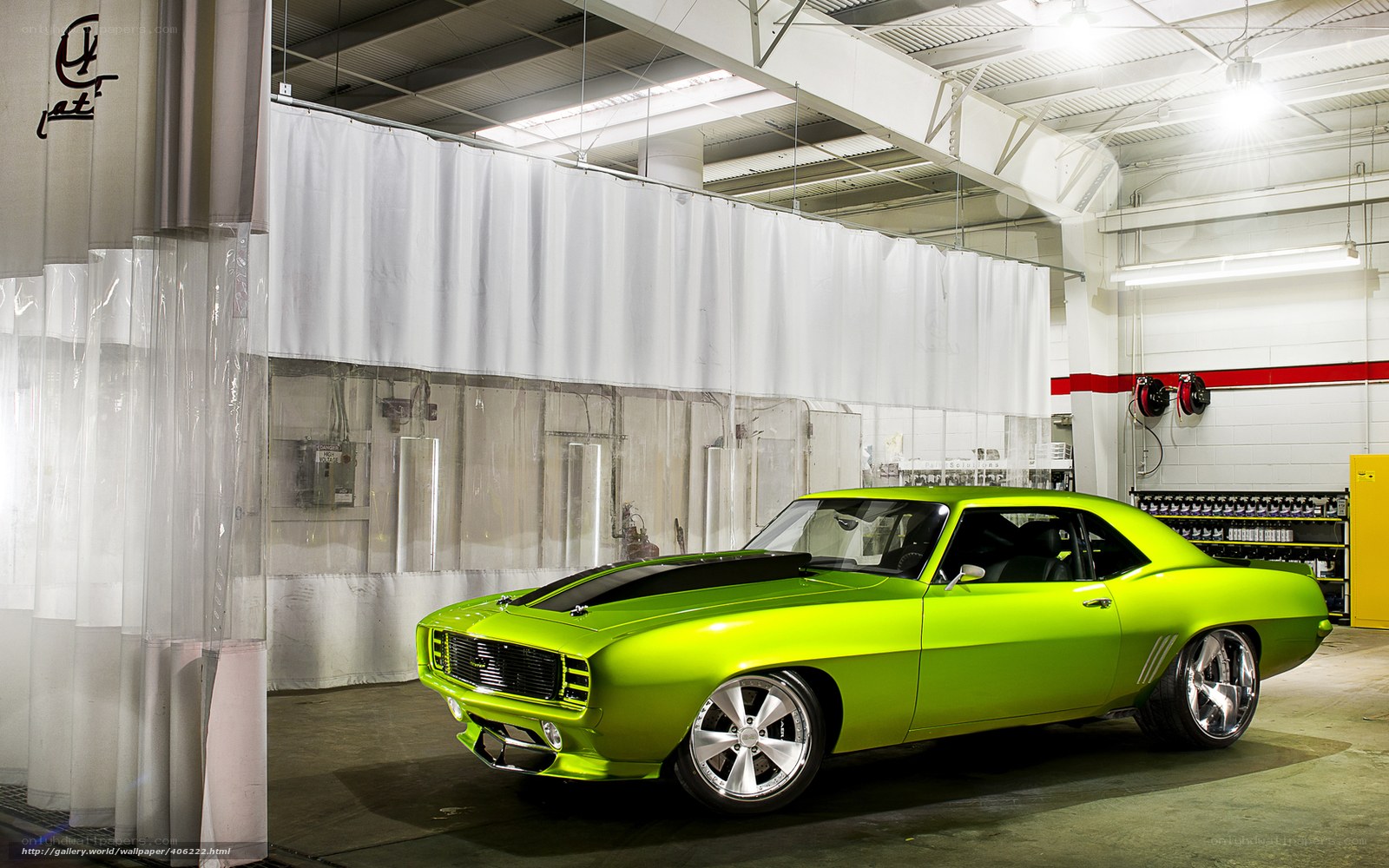 green muscle car in garage