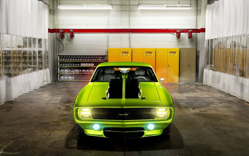 green muscle car in garage