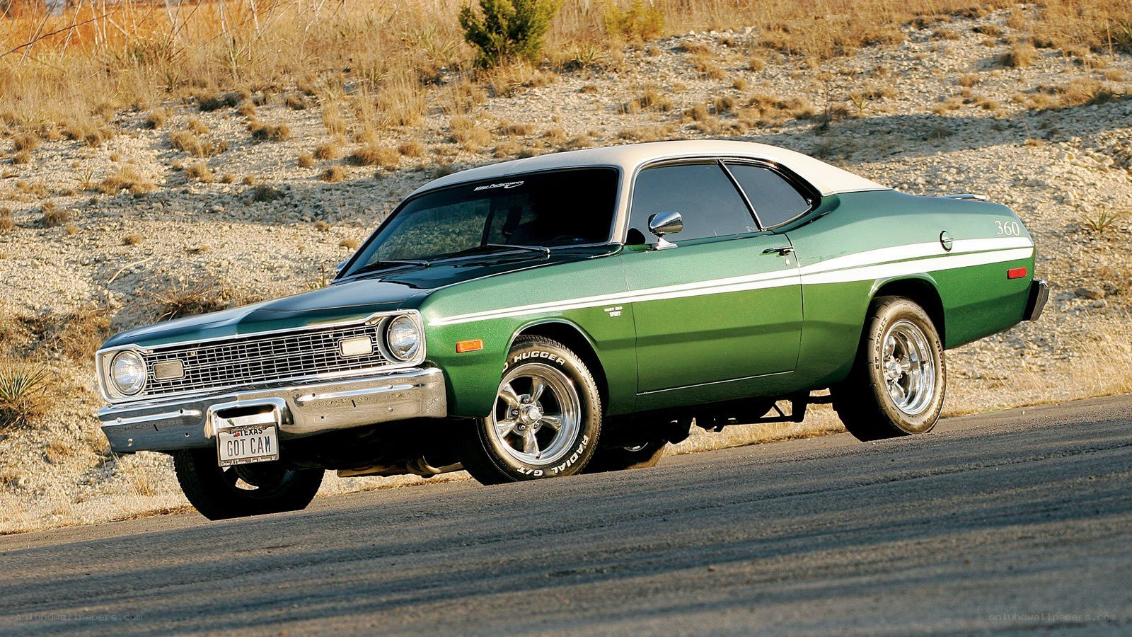 Green muscle car on road