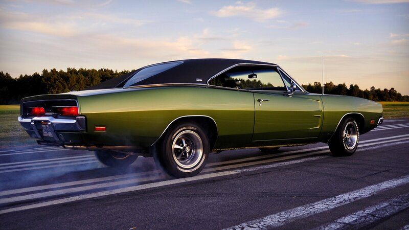 green muscle car on track