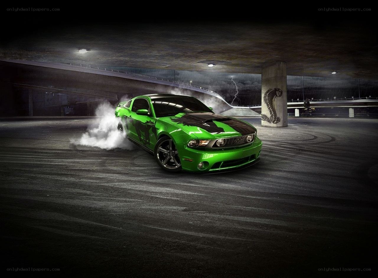 Green Mustang drifting at night