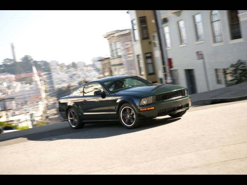 green mustang on city street