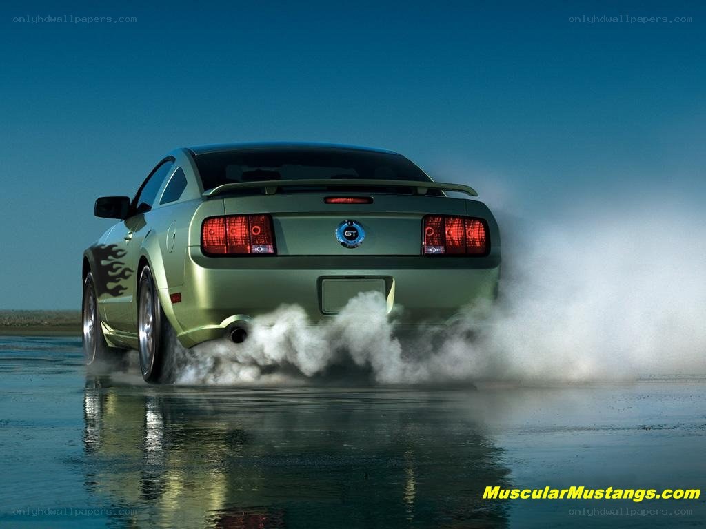 Green Mustang performing burnout