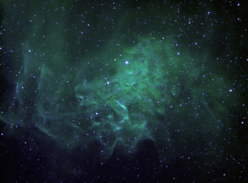 Green nebula in starfield