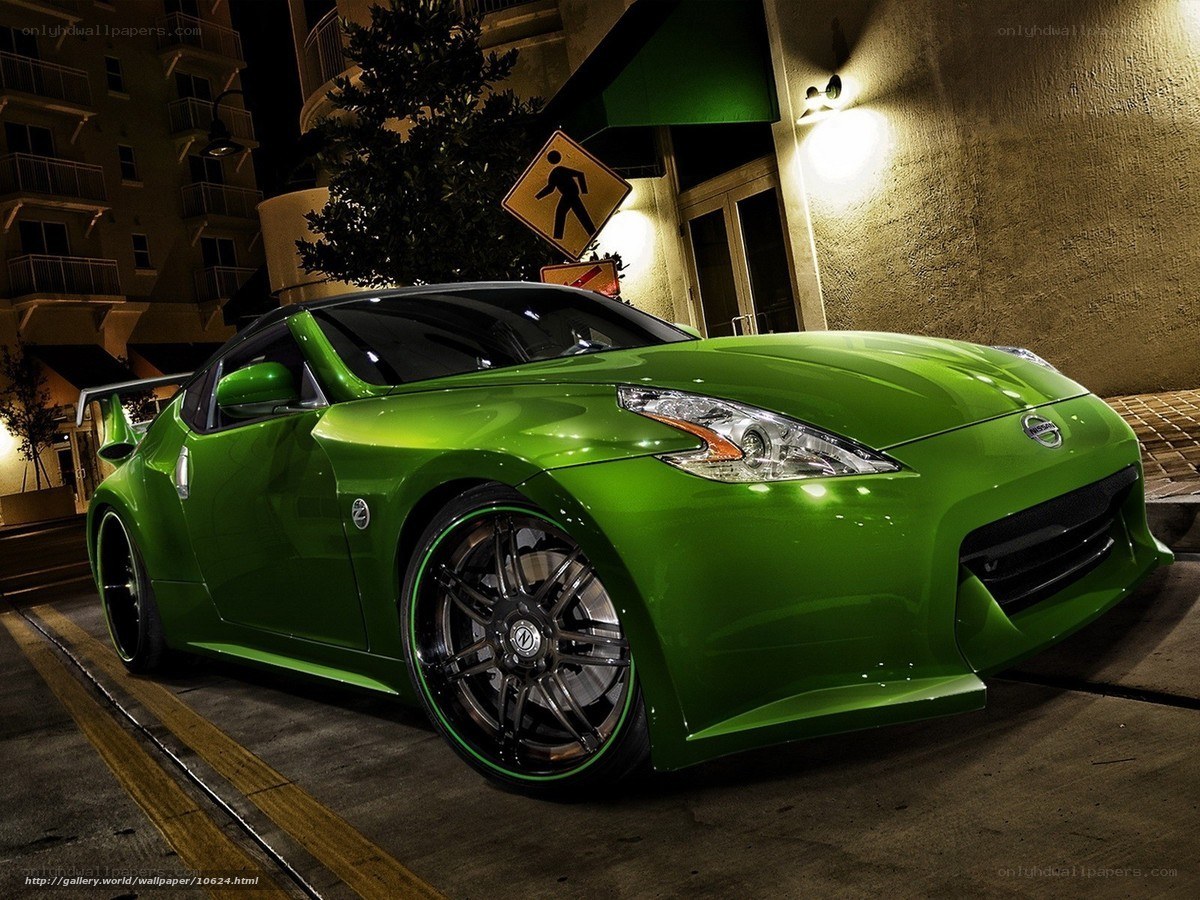 Green Nissan sports car at night
