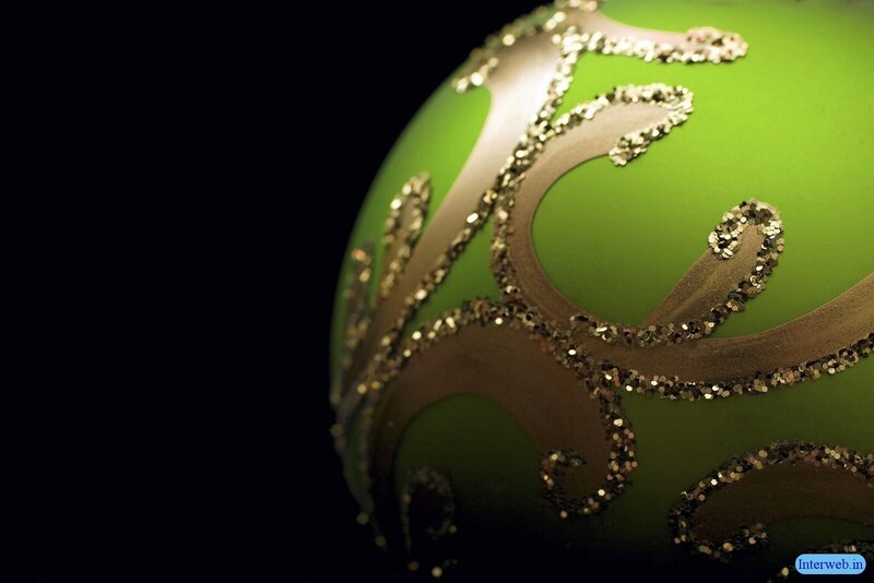 green ornament with gold glitter