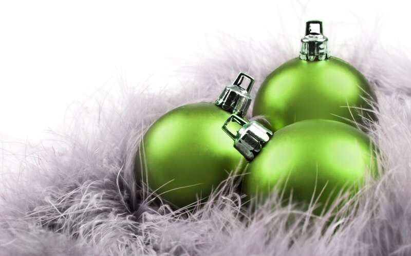 Green Ornaments on Feathers — Festive, Winter