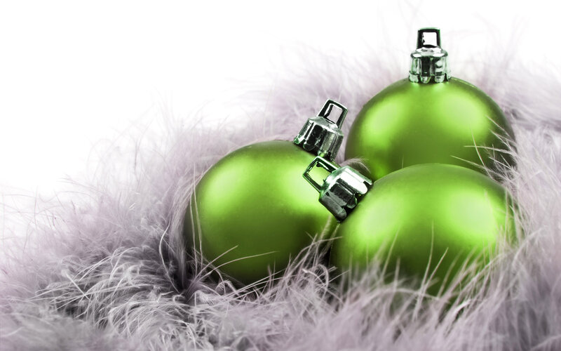 green ornaments on feathers