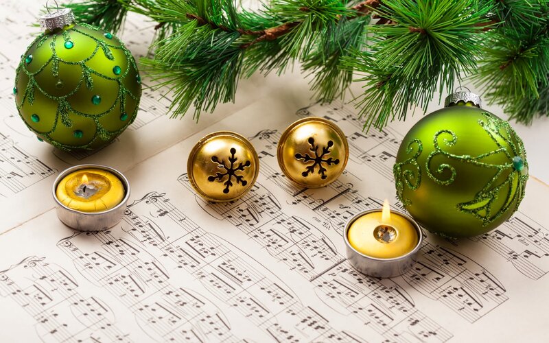 Green Ornaments on Sheet Music — Festive