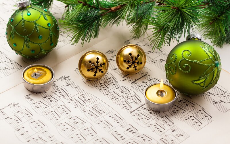 Green Ornaments on Sheet Music