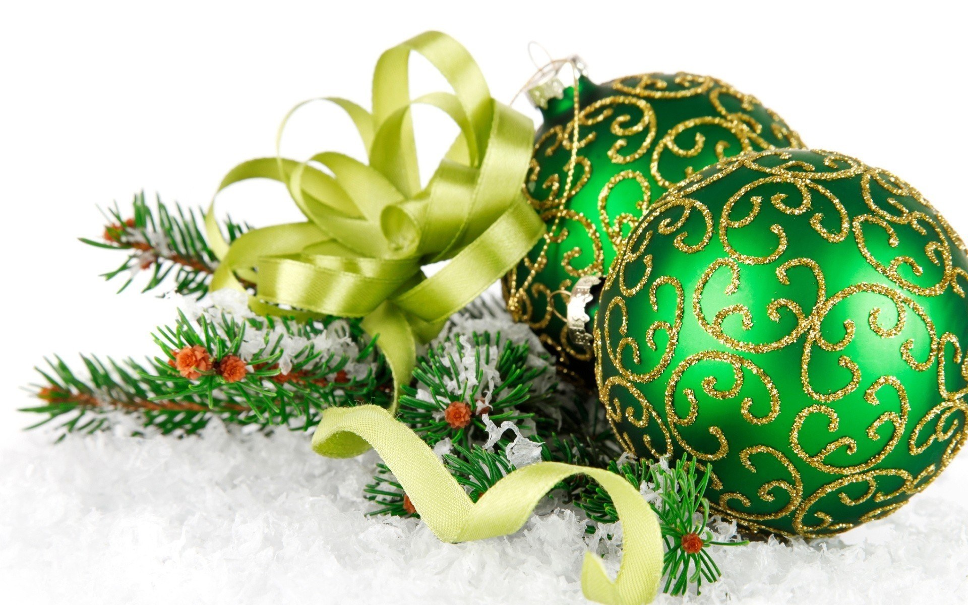 green ornaments on snow