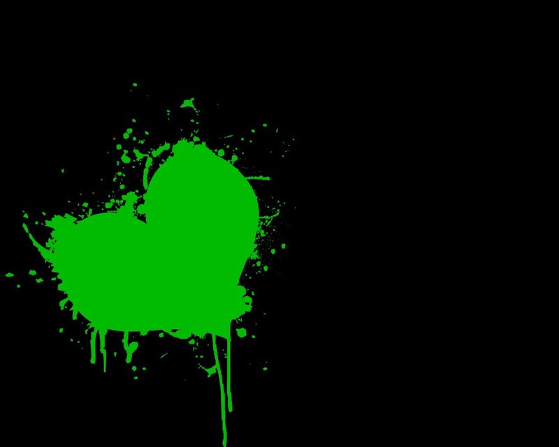green paint splatter on black