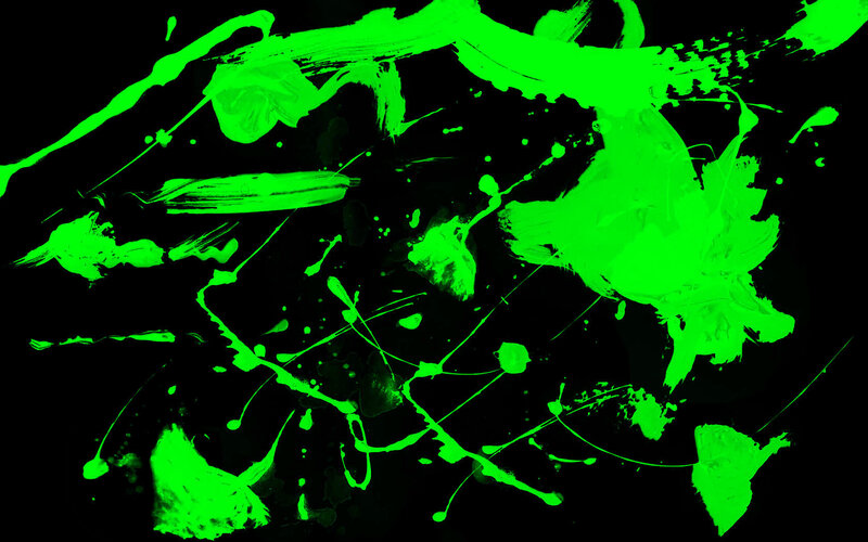 green paint splatters on black
