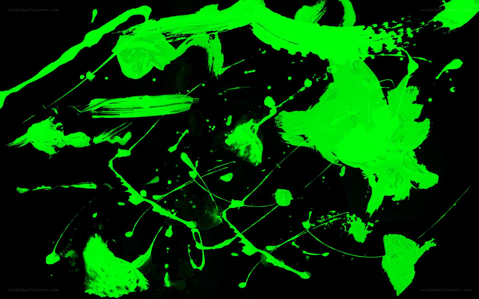 green paint splatters on black