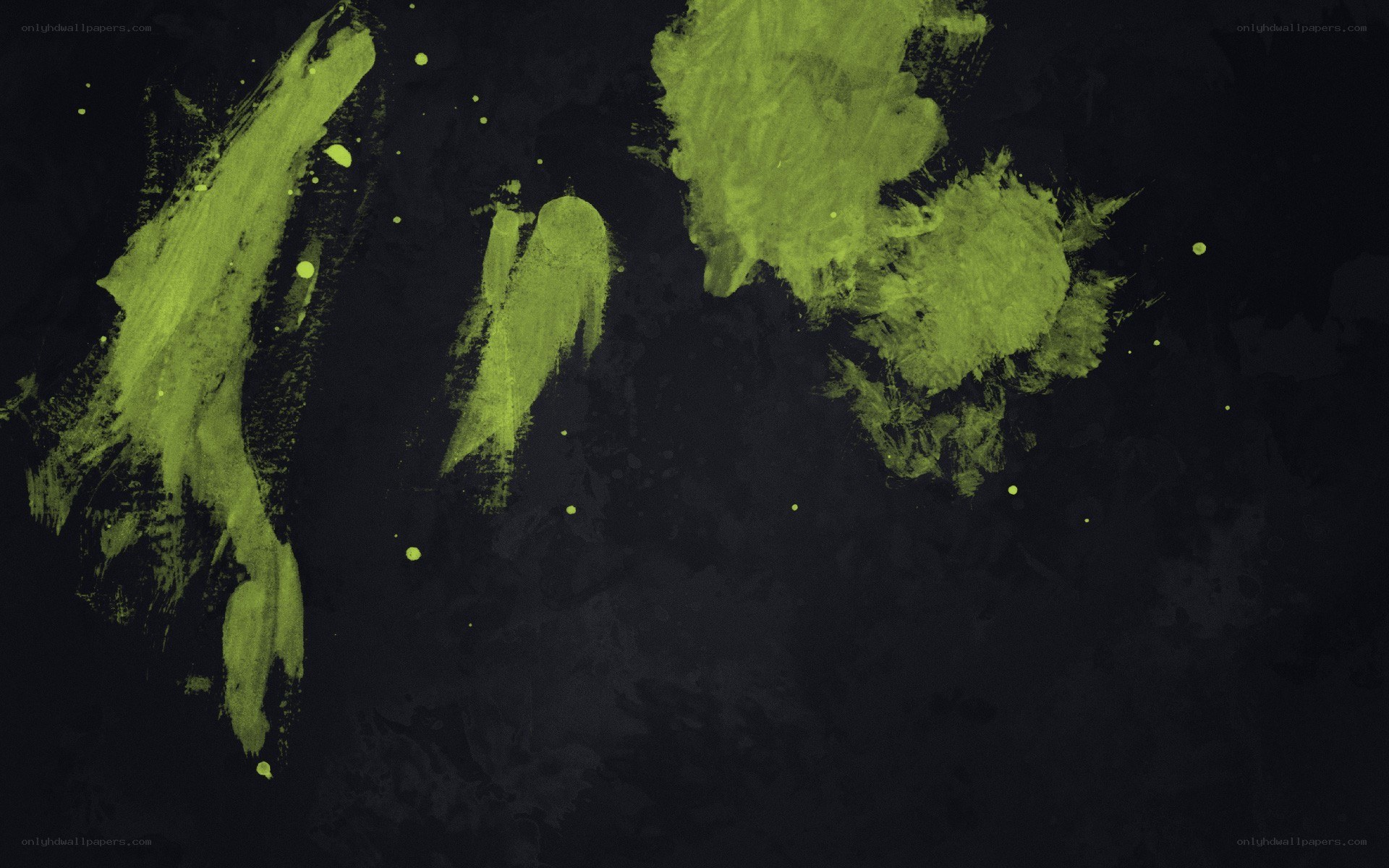 green paint splatters on black
