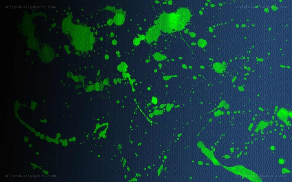 green paint splatters on dark blue