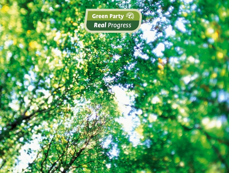 Green Party logo on forest background