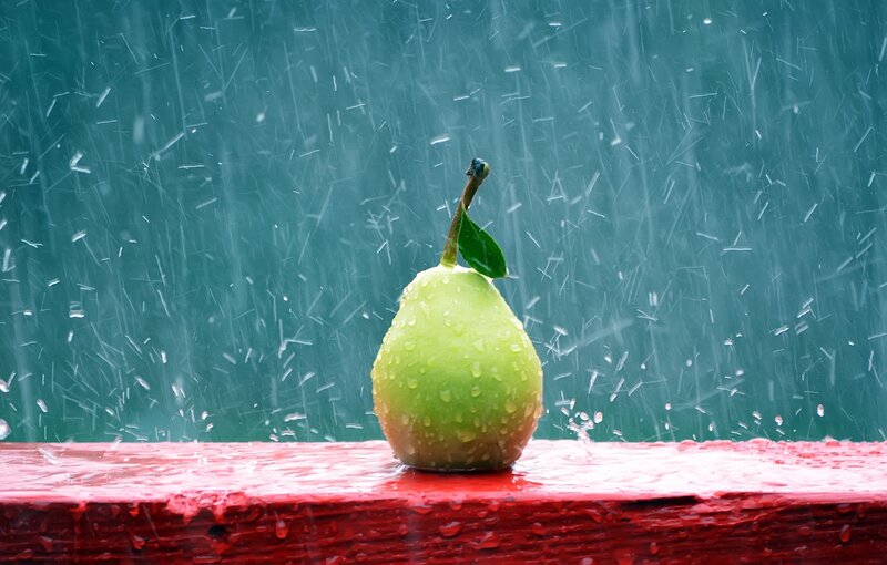 Green Pear in Rain — Dramatic, Photograph, Wooden Surface