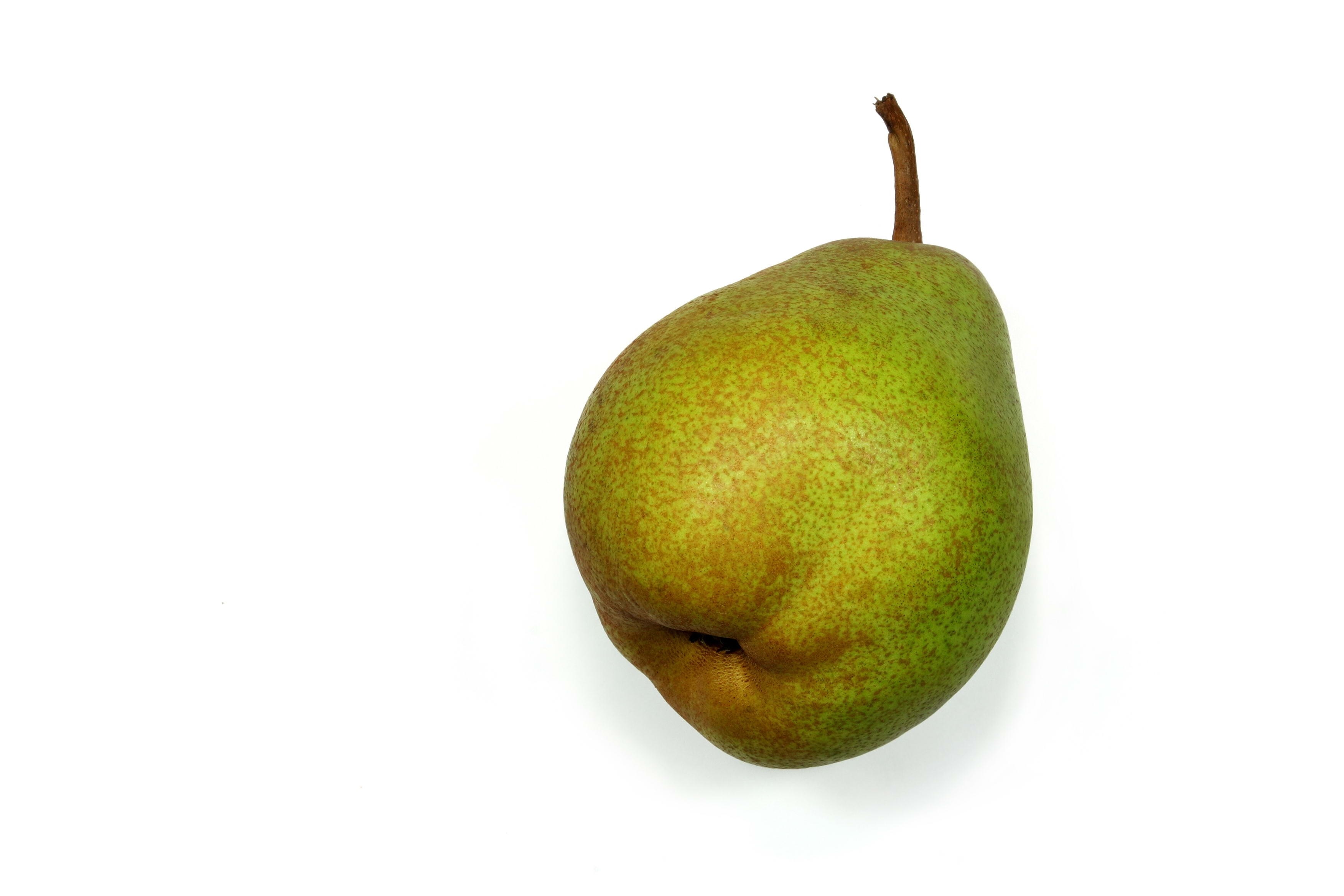 green pear on white background