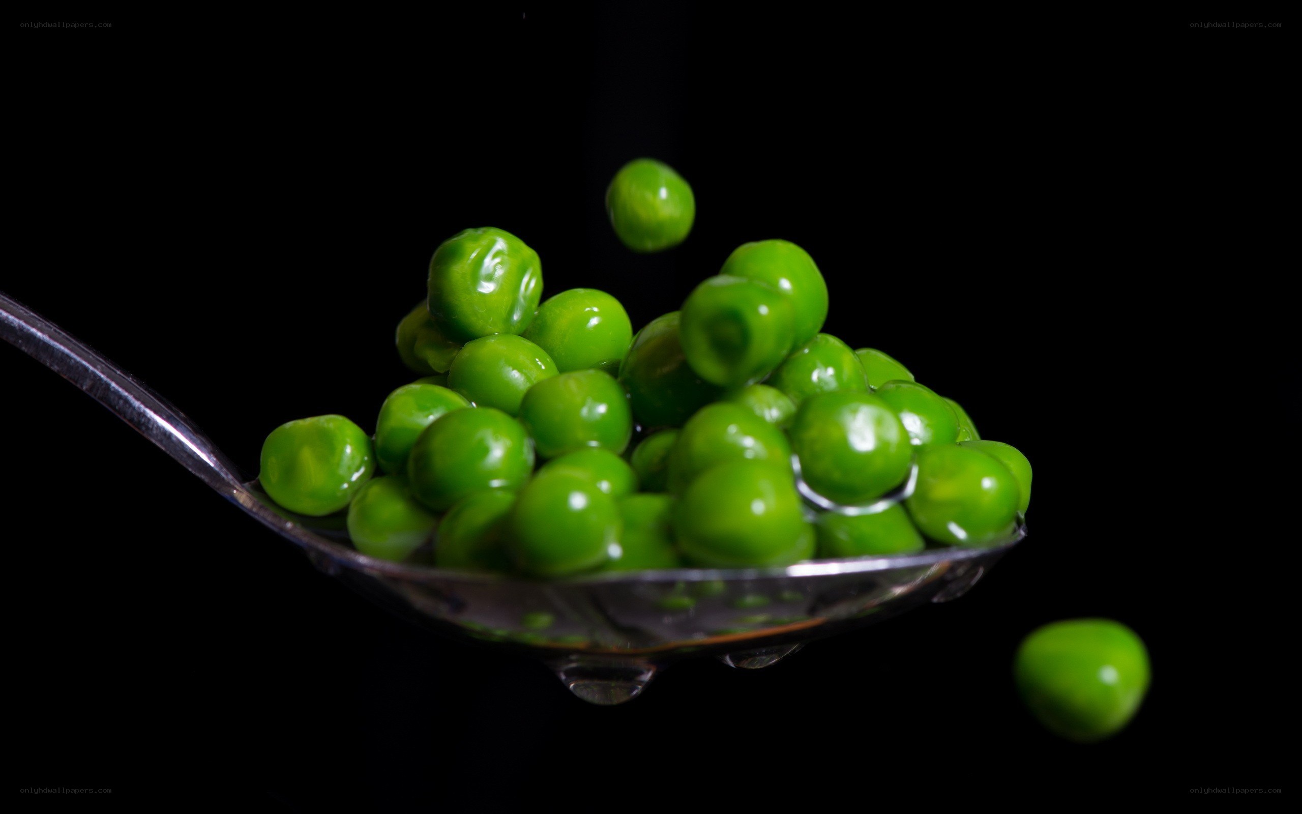 Green peas on a spoon