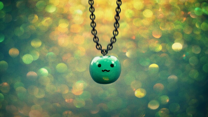 green pendant with face