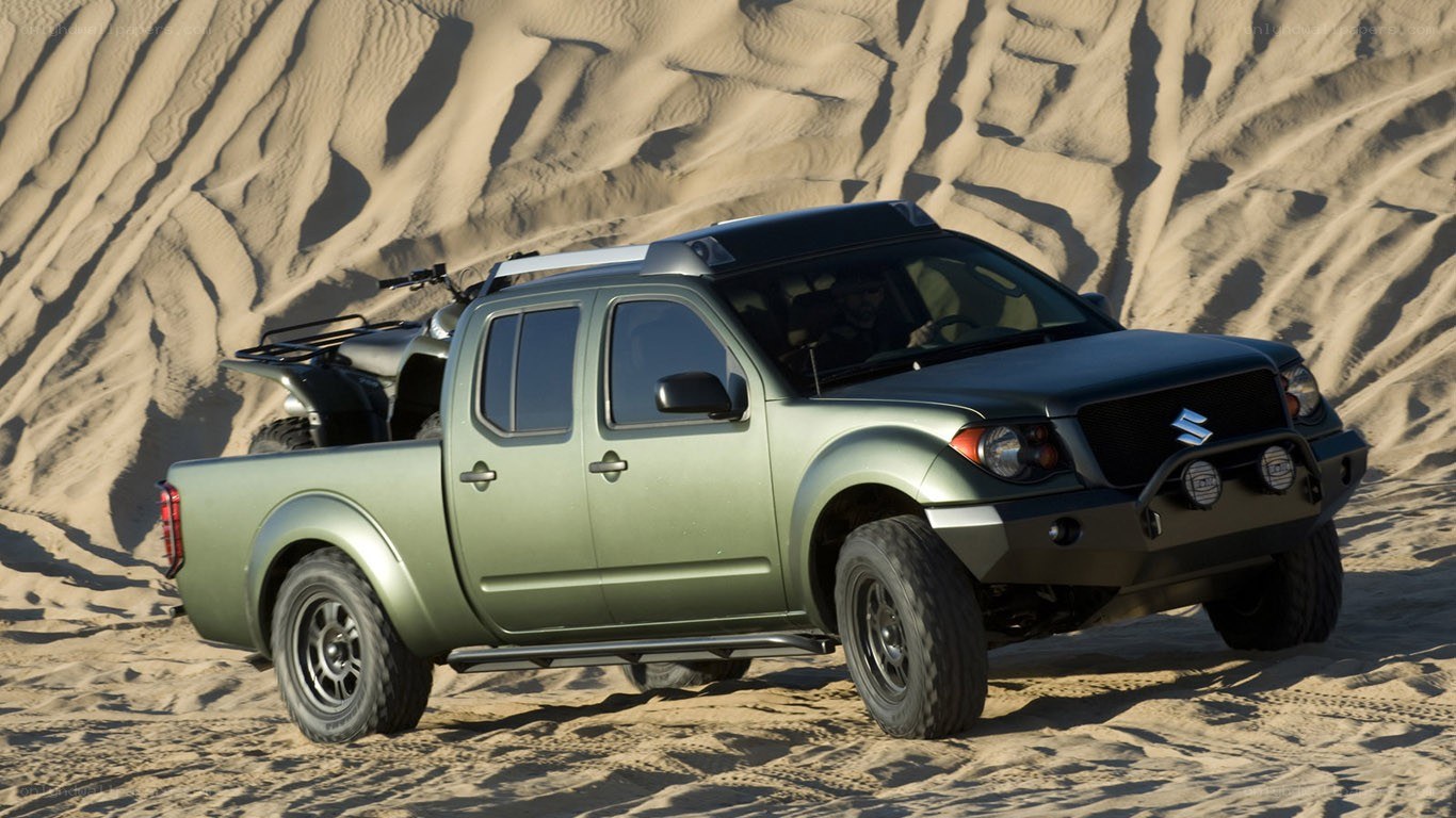 green pickup truck in desert
