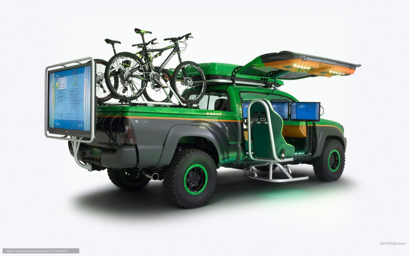 green pickup truck with gaming setup