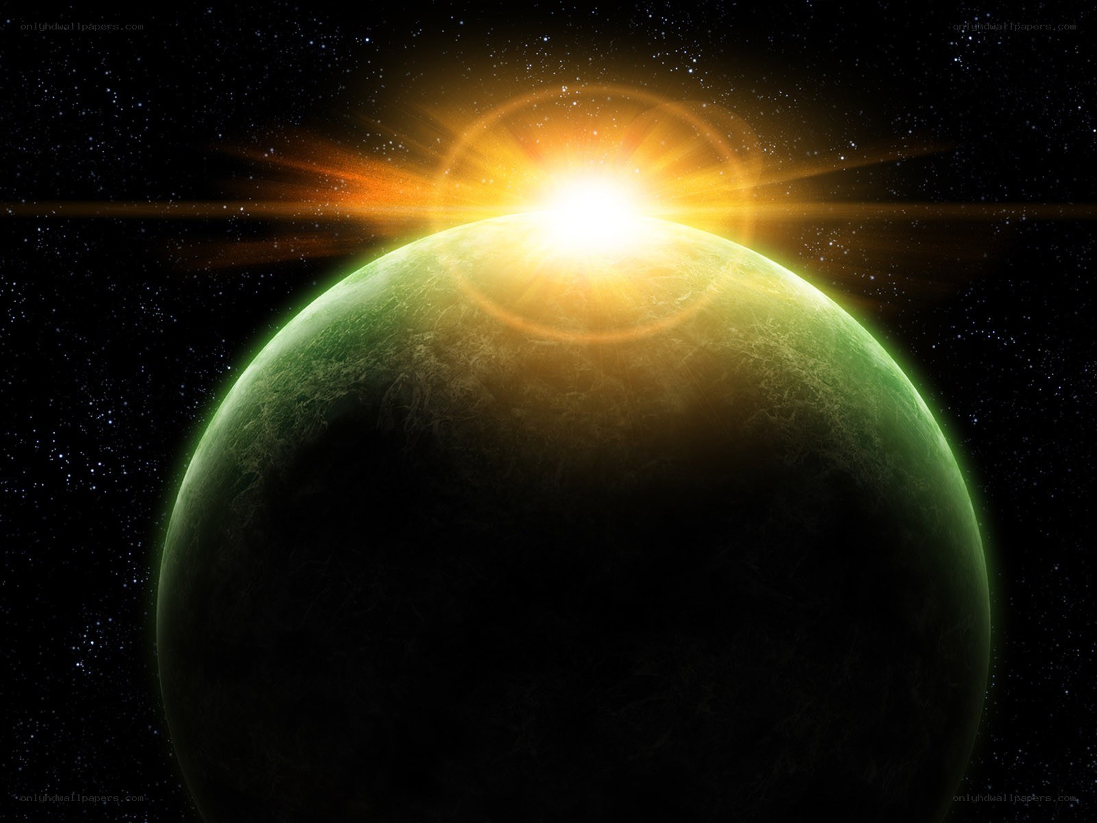 Green planet with sun rising