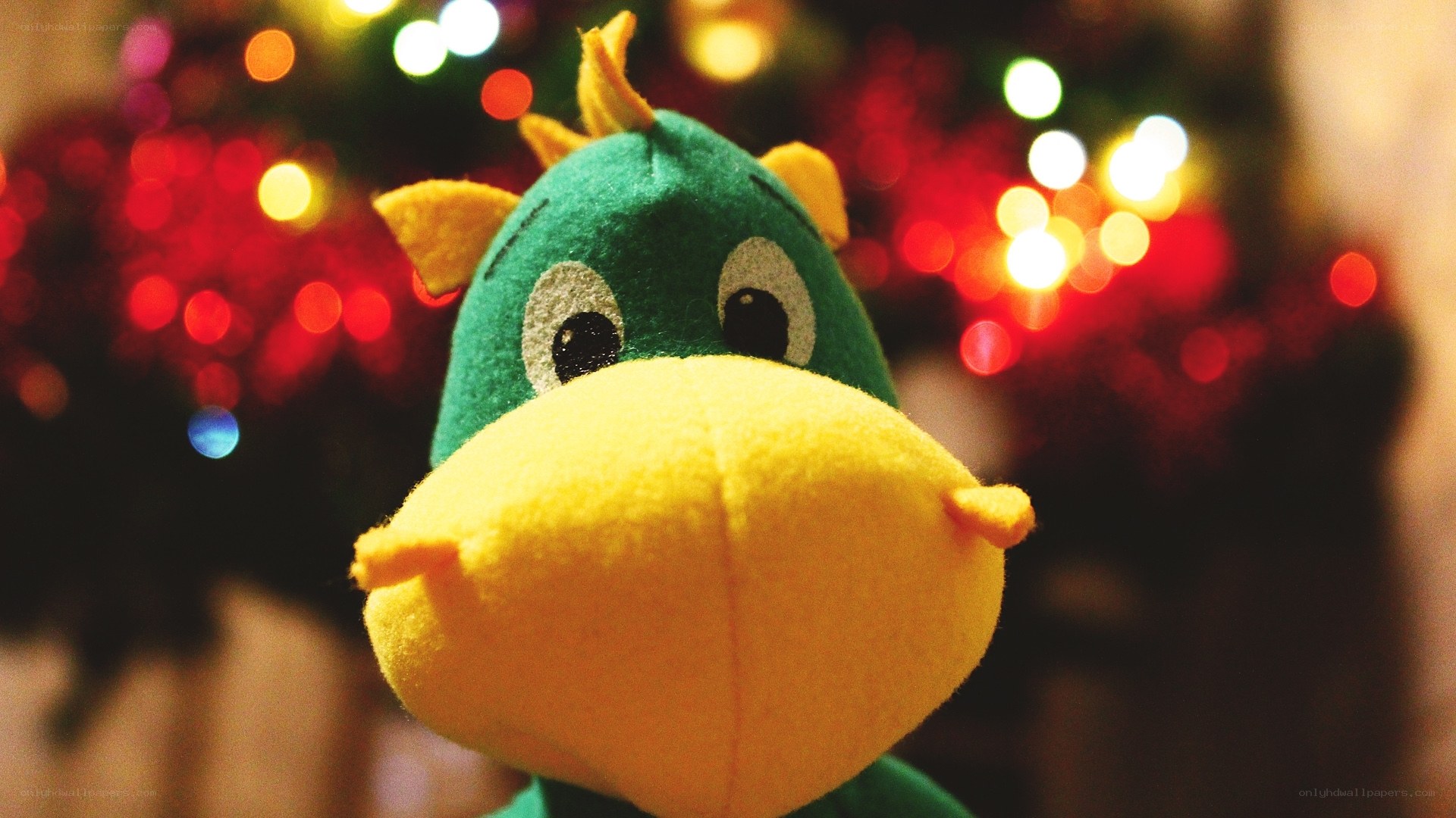 green plush toy in front of lights