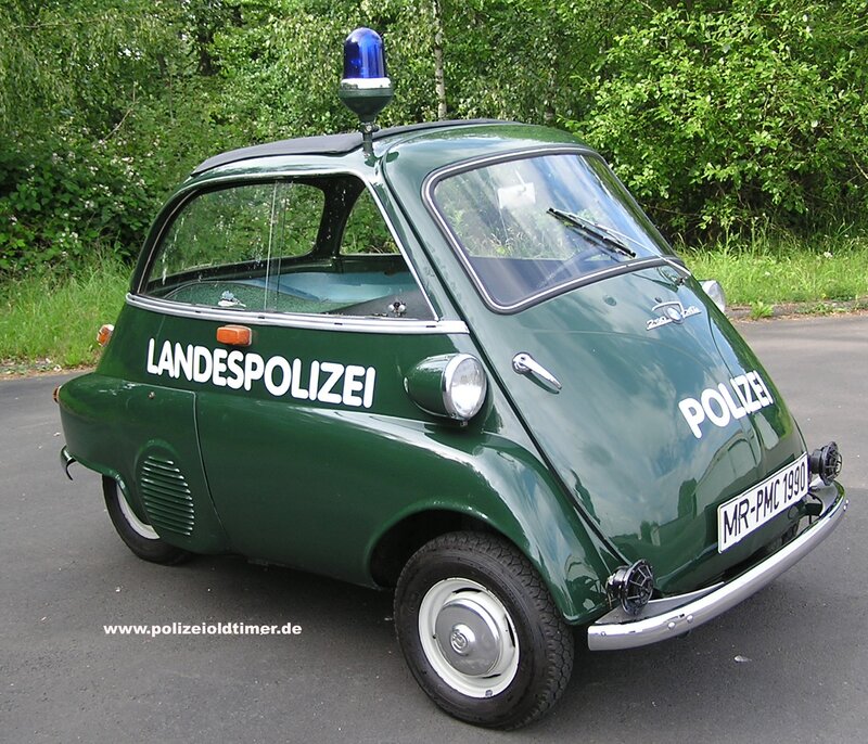 Green police car with blue light