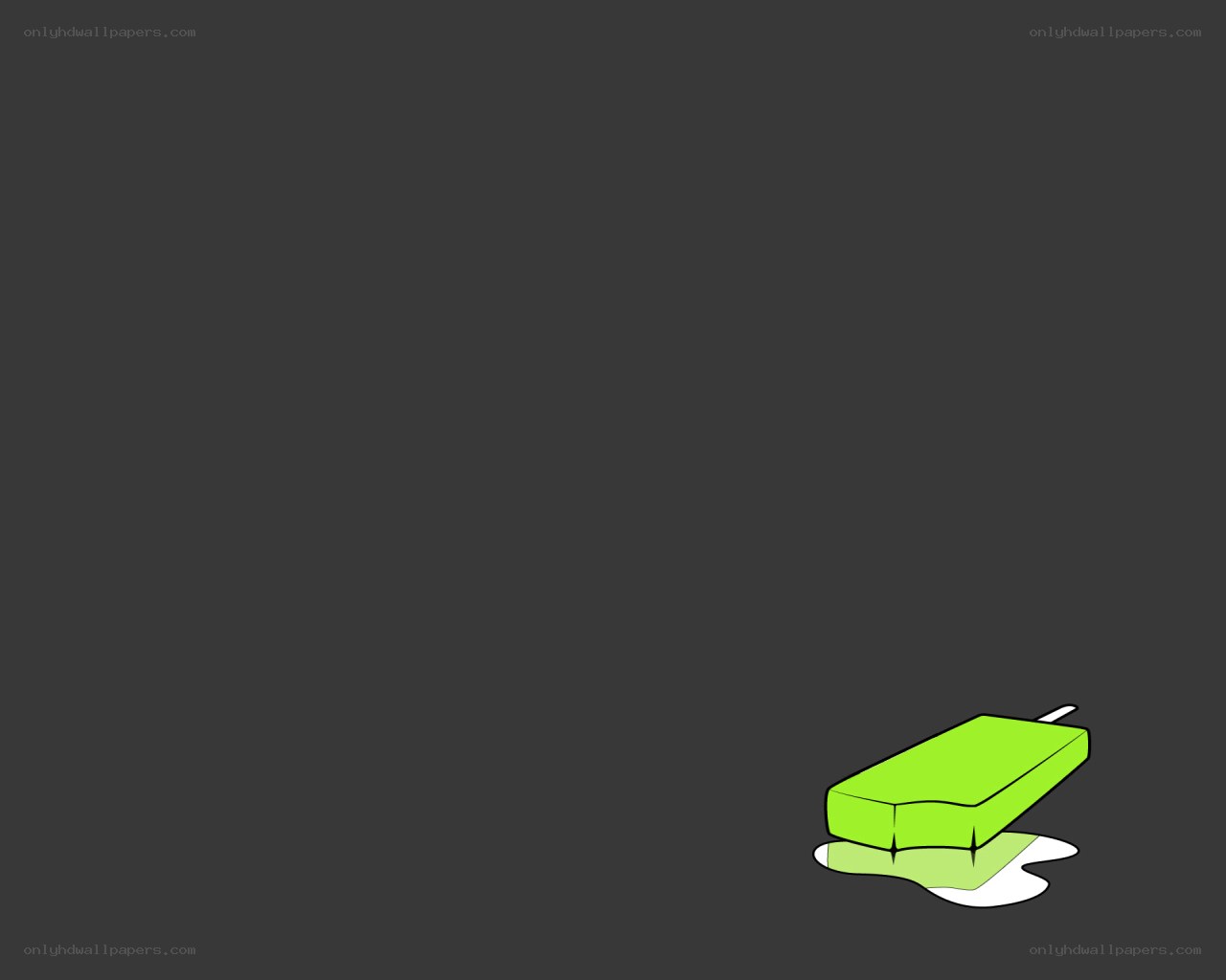green popsicle on dark background