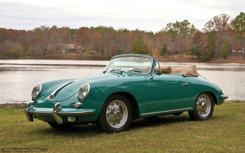 Green Porsche 356 by a lake