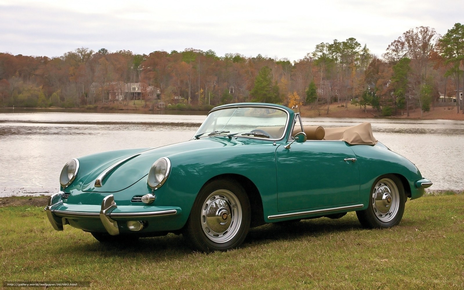 Green Porsche 356 by a lake