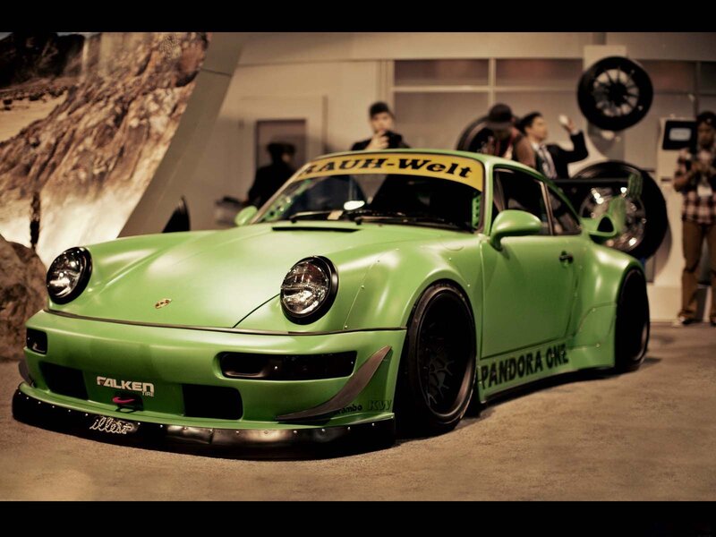 Green Porsche at an auto show