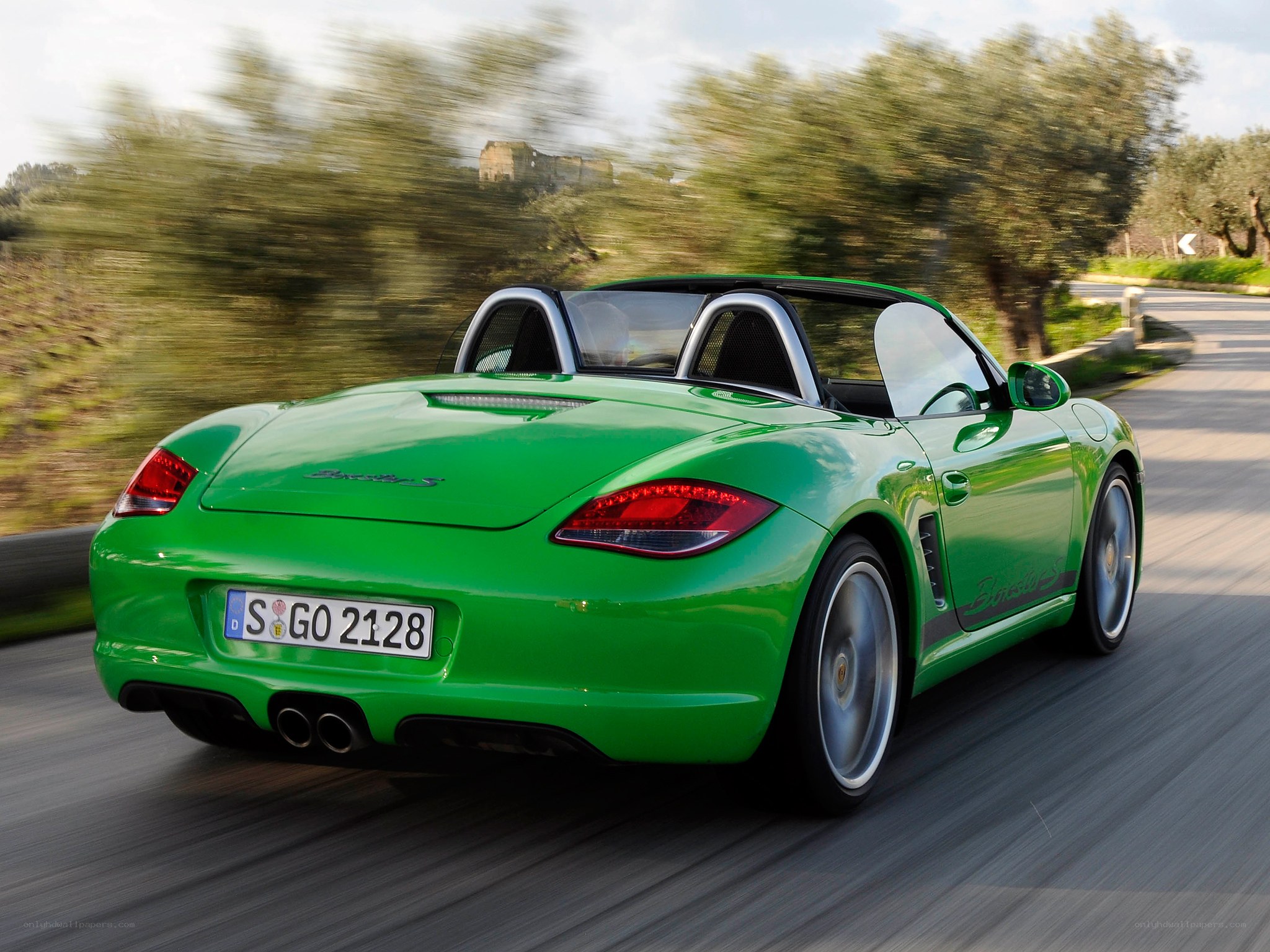 green porsche boxster s driving