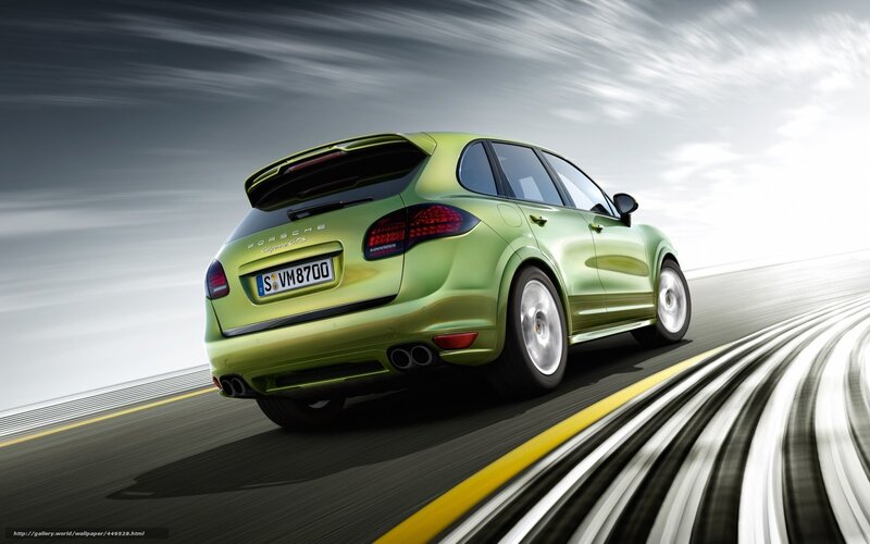 green porsche cayenne in motion