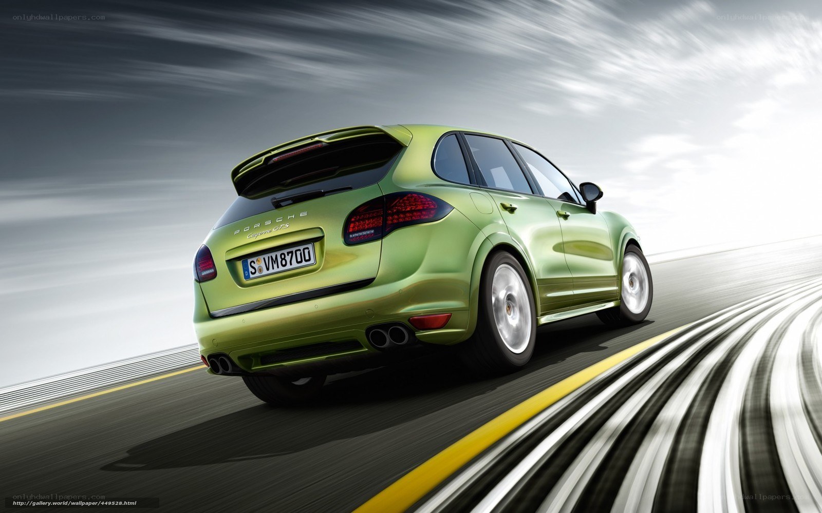 green porsche cayenne in motion