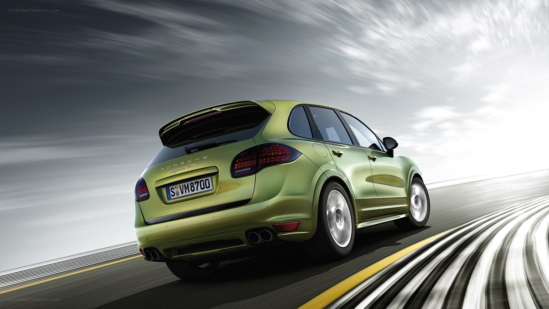 green porsche cayenne in motion