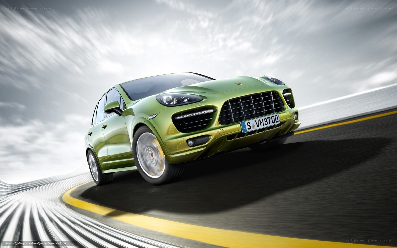 Green Porsche Cayenne in motion