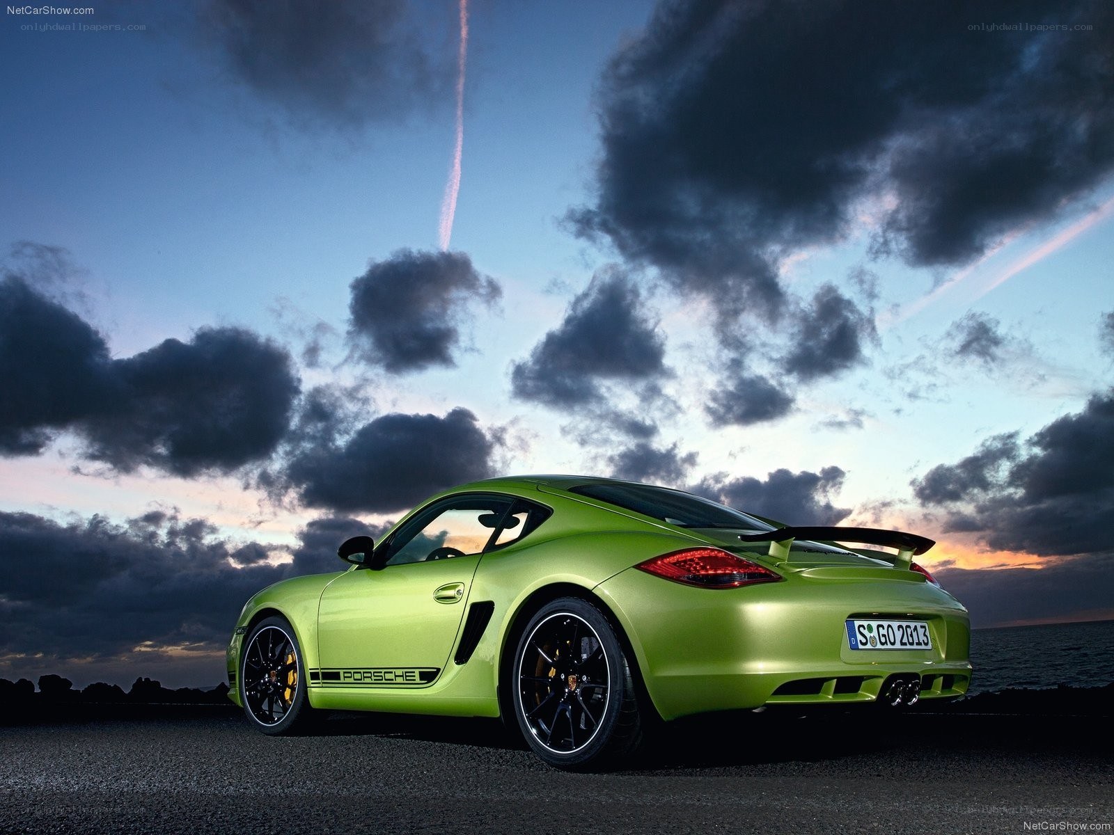 green porsche cayman at sunset