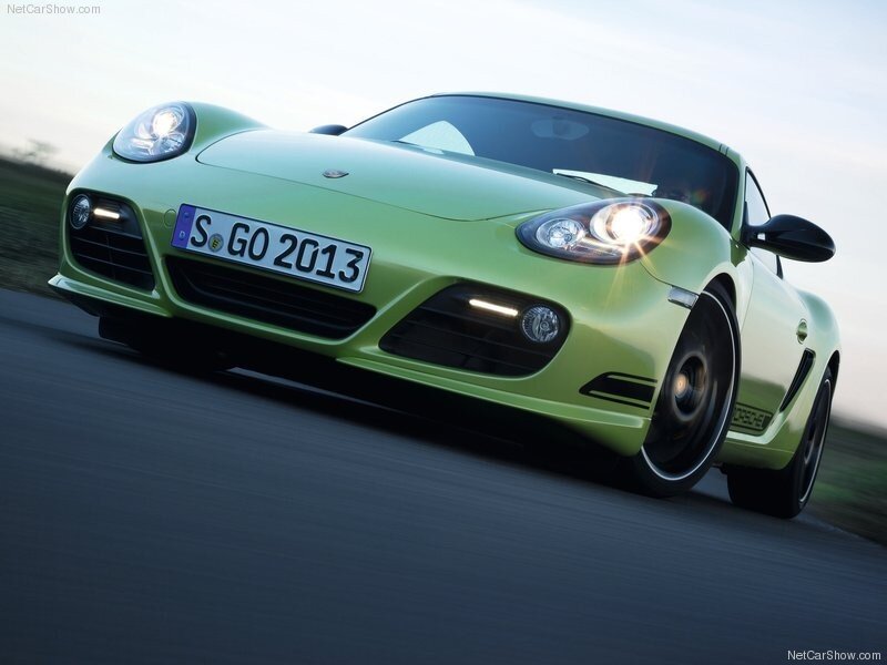 green porsche cayman in motion