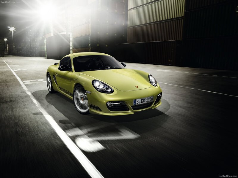 Green Porsche Cayman in motion
