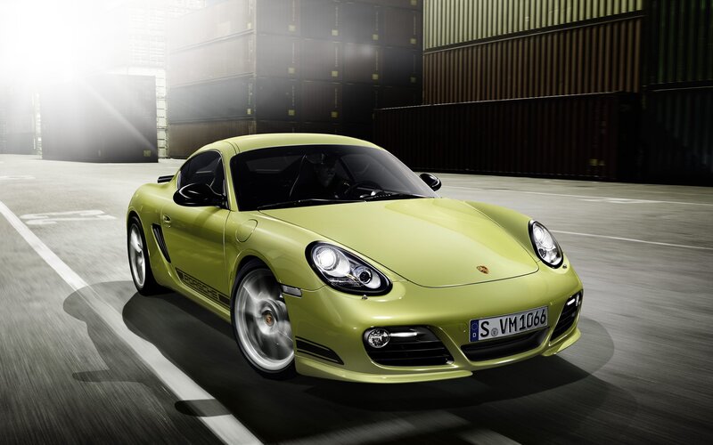 Green Porsche Cayman in motion