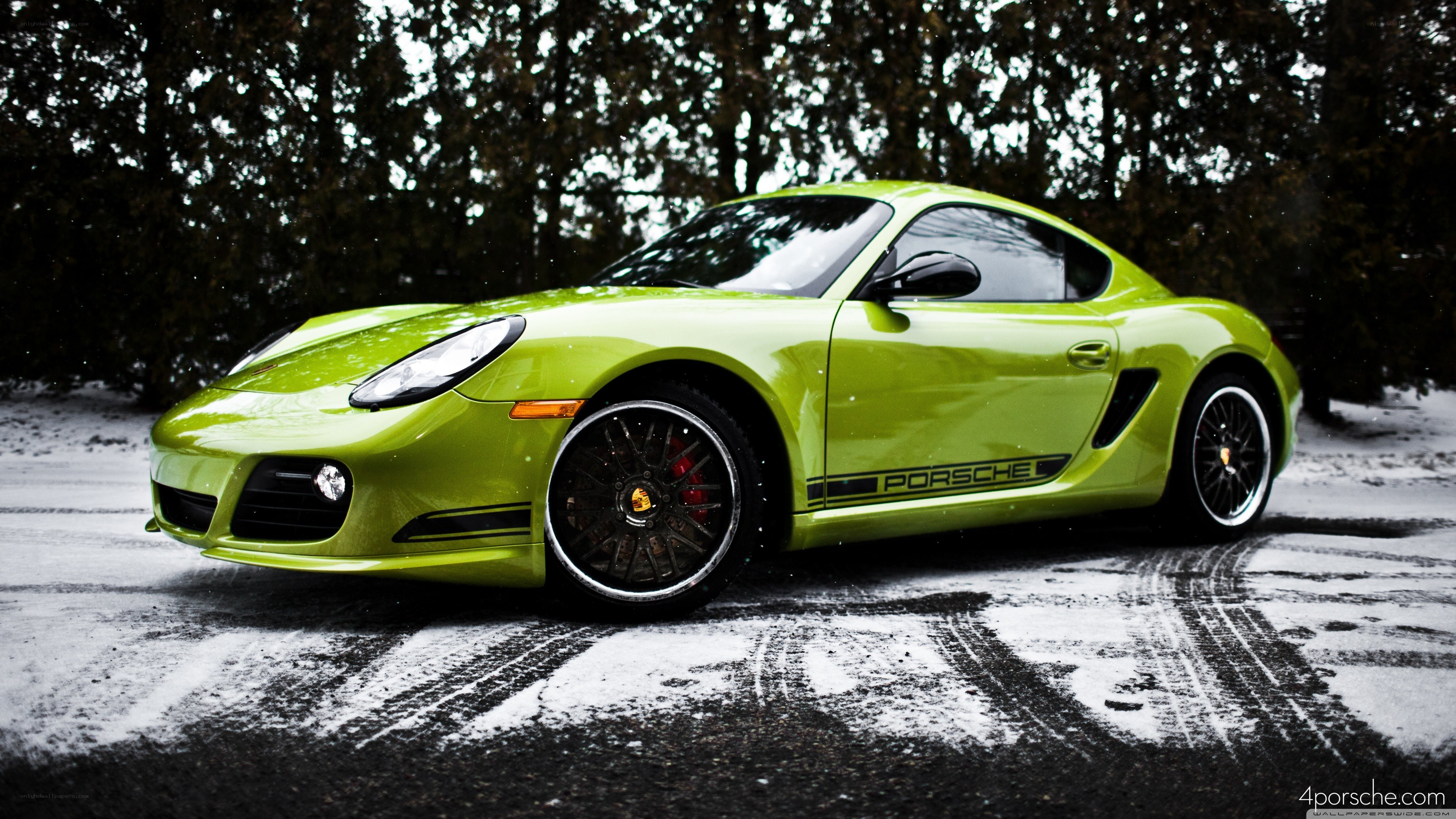 green porsche in snow