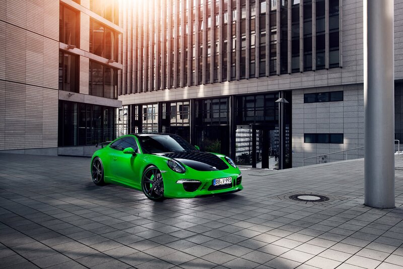 Green Porsche in urban setting